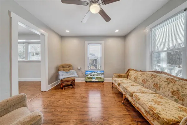 a living room with furniture and a large window