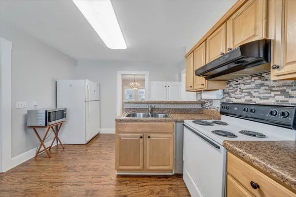 a kitchen with a stove and a sink