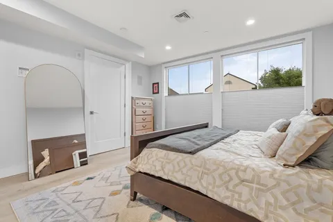 a bedroom with a bed and a dresser