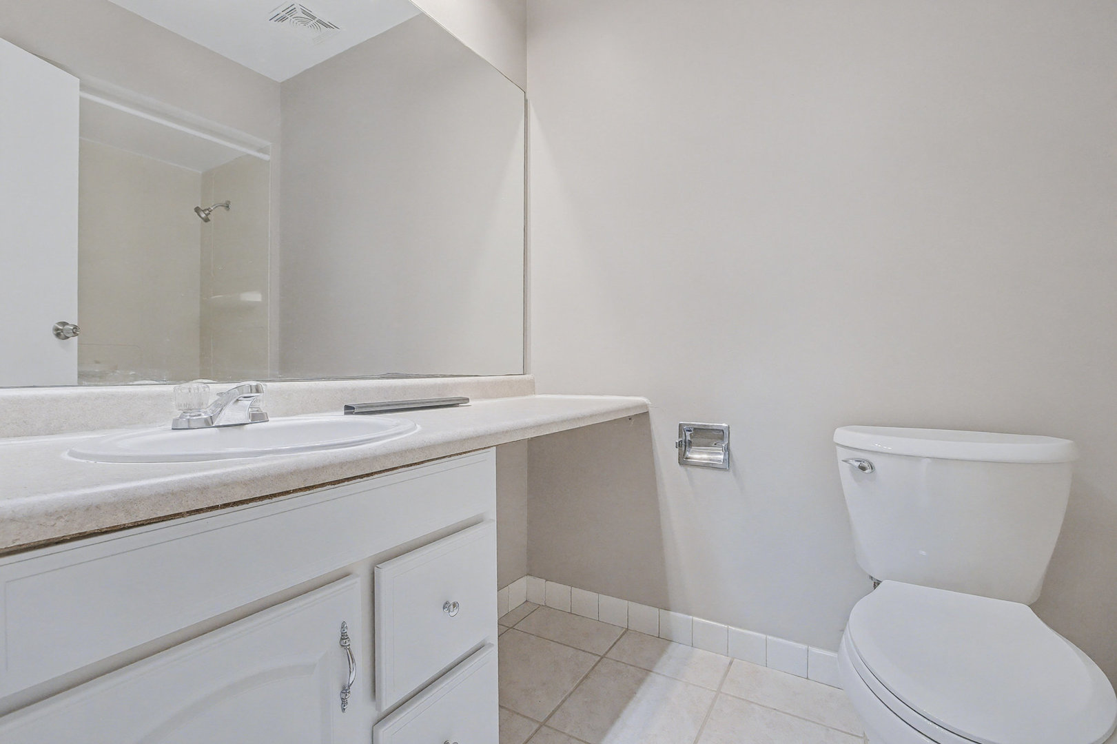 2932 Roberts Drive, Unit 7 Woodridge, IL 60517 - Photo 18 of 28 a bathroom with a toilet sink and mirror