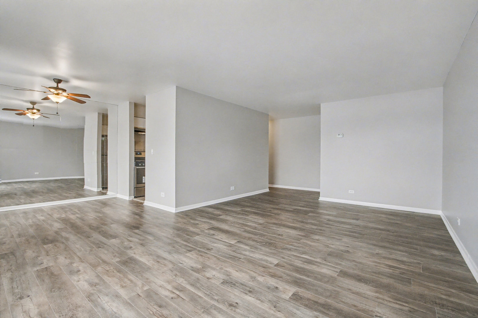 2932 Roberts Drive, Unit 7 Woodridge, IL 60517 - Photo 2 of 28 a view of empty room with wooden floor