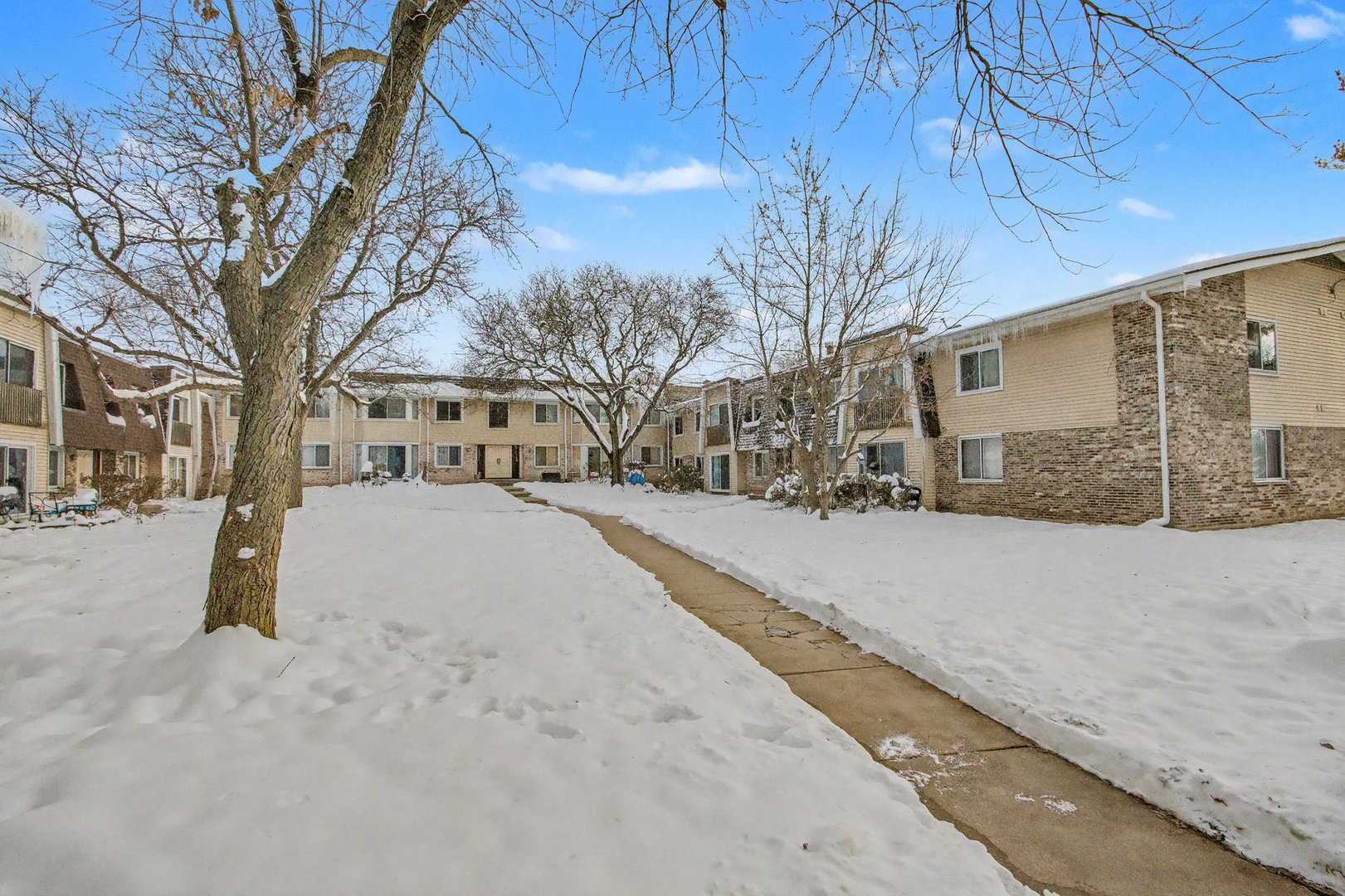 2932 Roberts Drive, Unit 7 Woodridge, IL 60517 - Photo 23 of 28 a street view covered with snow