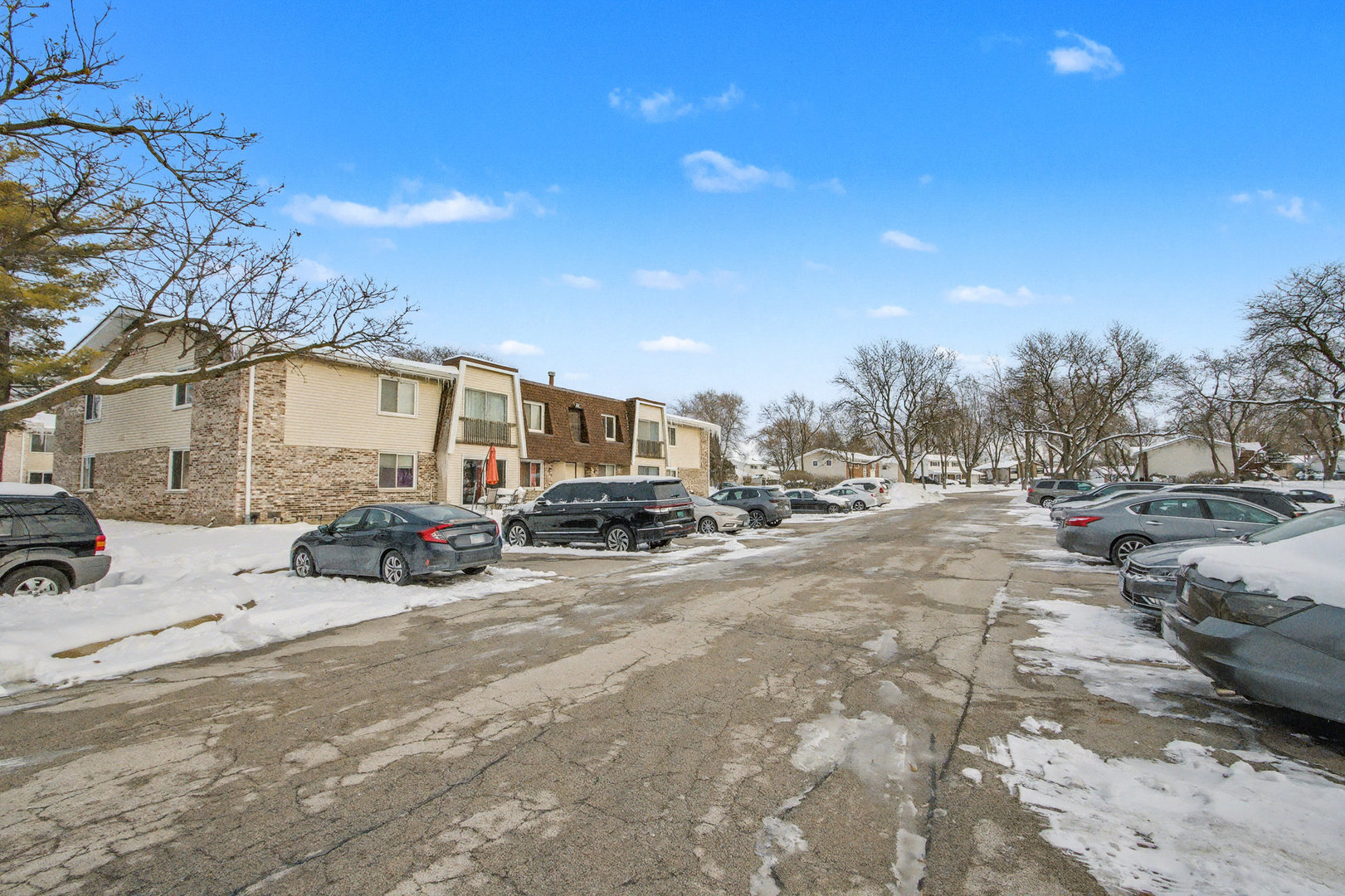 2932 Roberts Drive, Unit 7 Woodridge, IL 60517 - Photo 25 of 28 a view of a street with cars