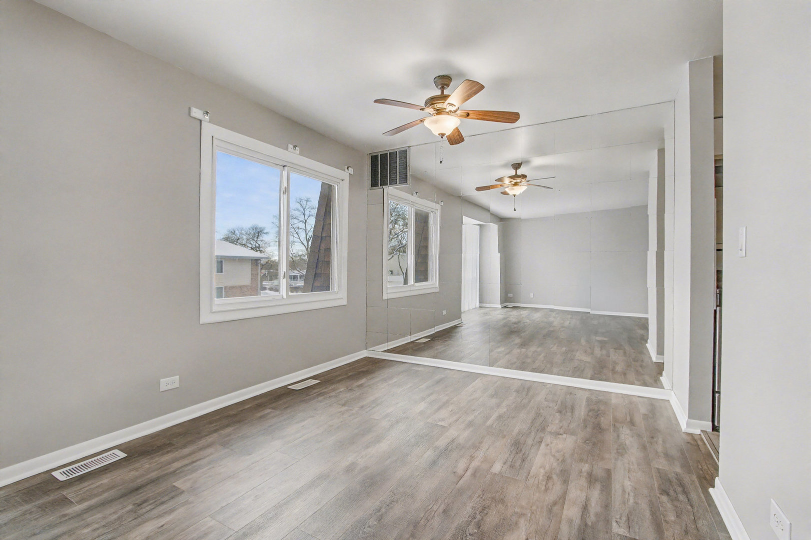 2932 Roberts Drive, Unit 7 Woodridge, IL 60517 - Photo 5 of 28 a view of livingroom with hardwood floor and ceiling fan