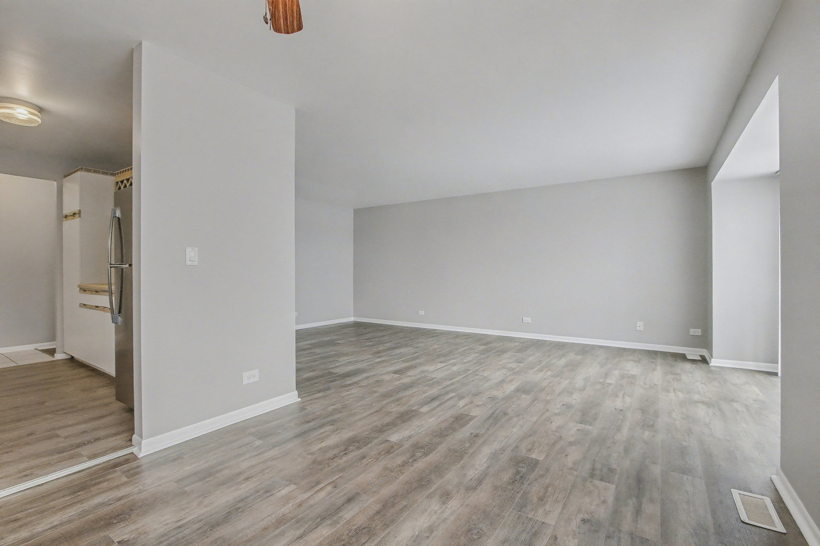 2932 Roberts Drive, Unit 7 Woodridge, IL 60517 - Photo 8 of 28 wooden floor in an empty room