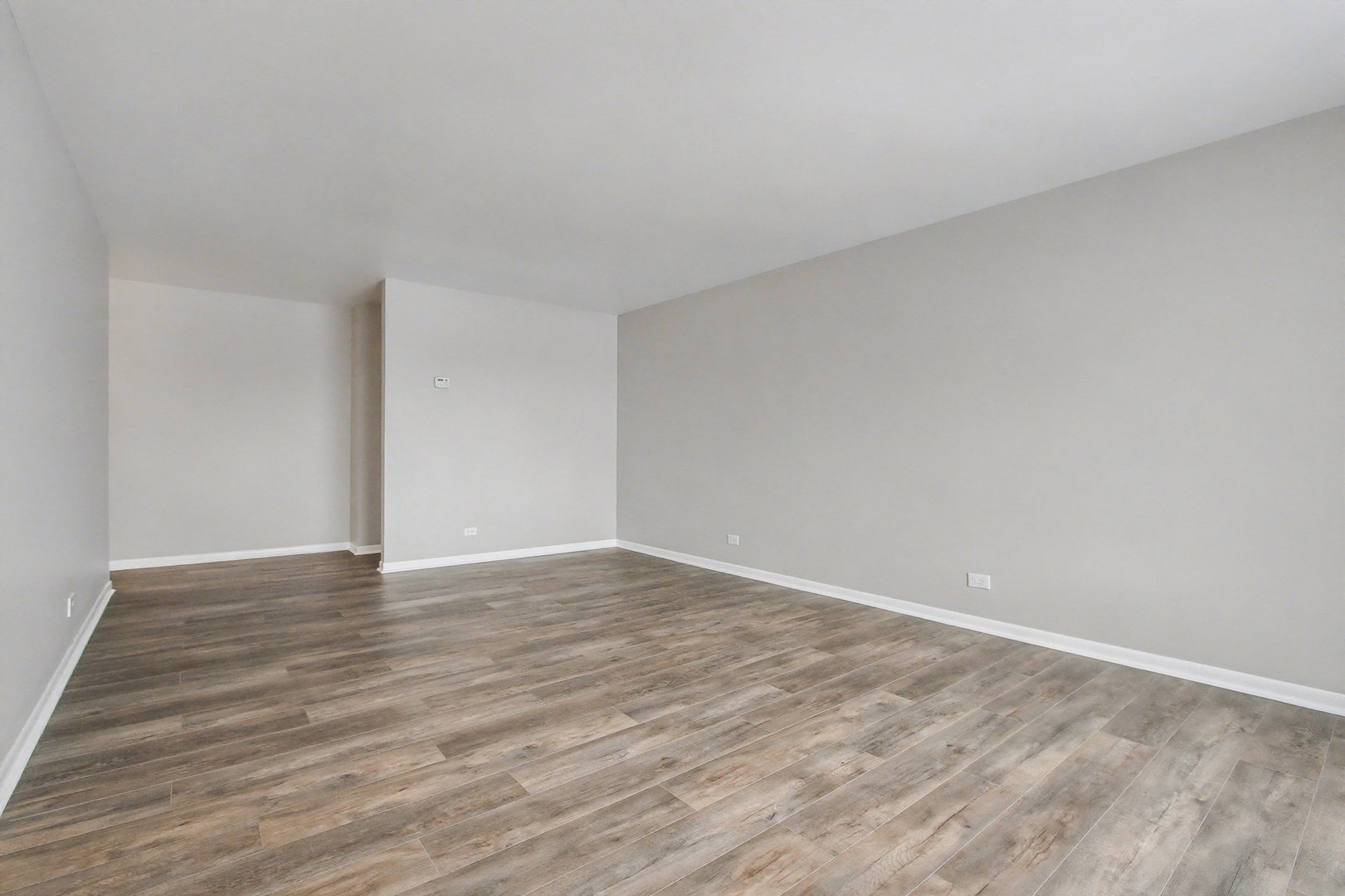 2932 Roberts Drive, Unit 7 Woodridge, IL 60517 - Photo 9 of 28 a view of an empty room and wooden floor