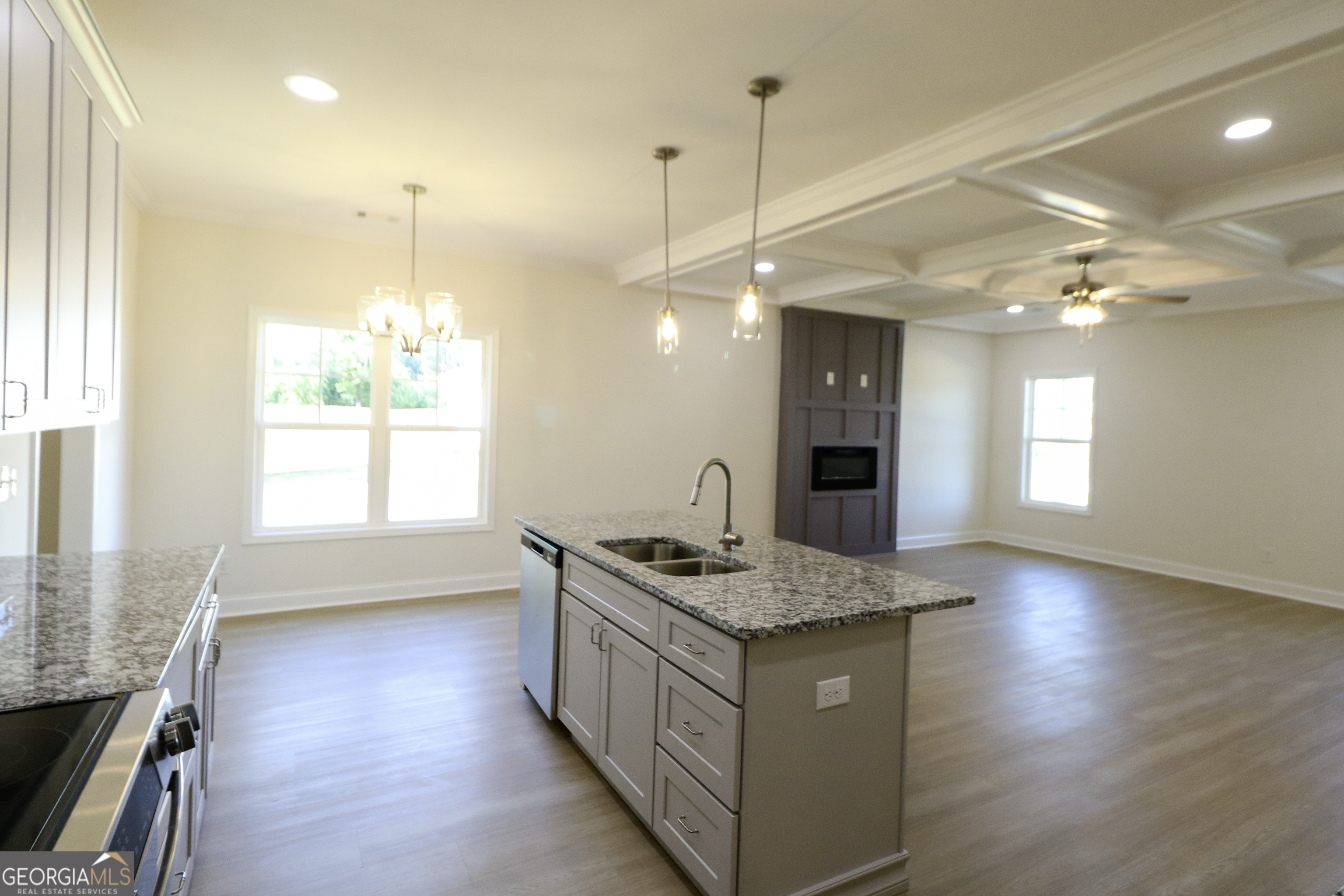 115 Sutter Butte Place Bonaire, GA 31005 - Photo 13 of 38 a bathroom with a granite countertop sink a large mirror and a bathtub
