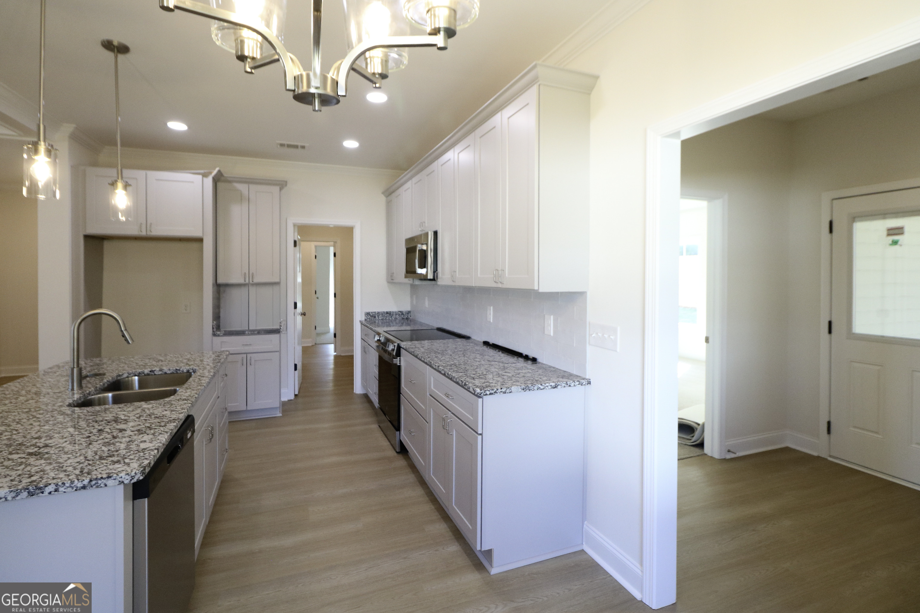 115 Sutter Butte Place Bonaire, GA 31005 - Photo 14 of 38 a open kitchen with stainless steel appliances granite countertop a sink stove and refrigerator
