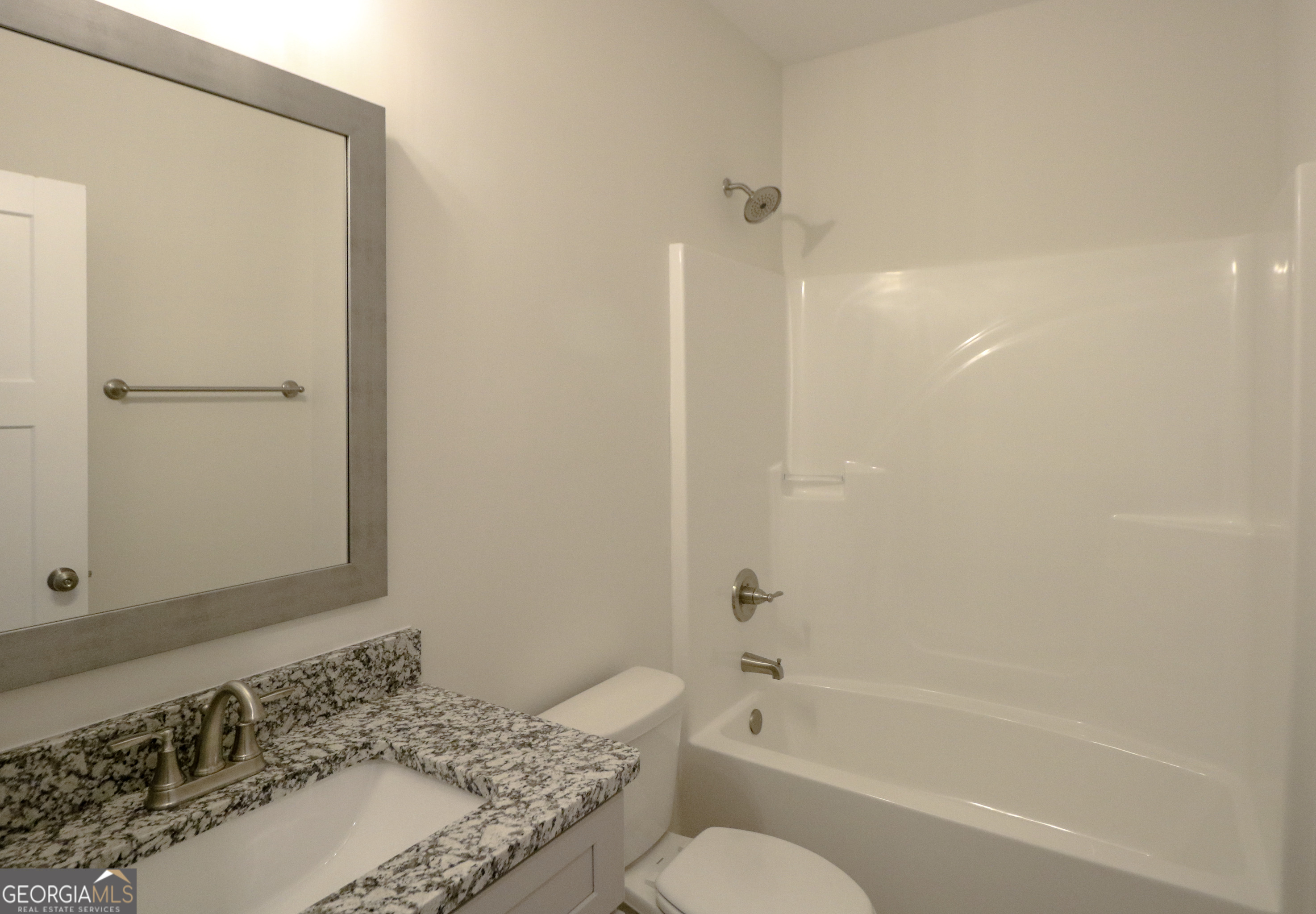 115 Sutter Butte Place Bonaire, GA 31005 - Photo 16 of 38 a bathroom with a granite countertop sink toilet and shower