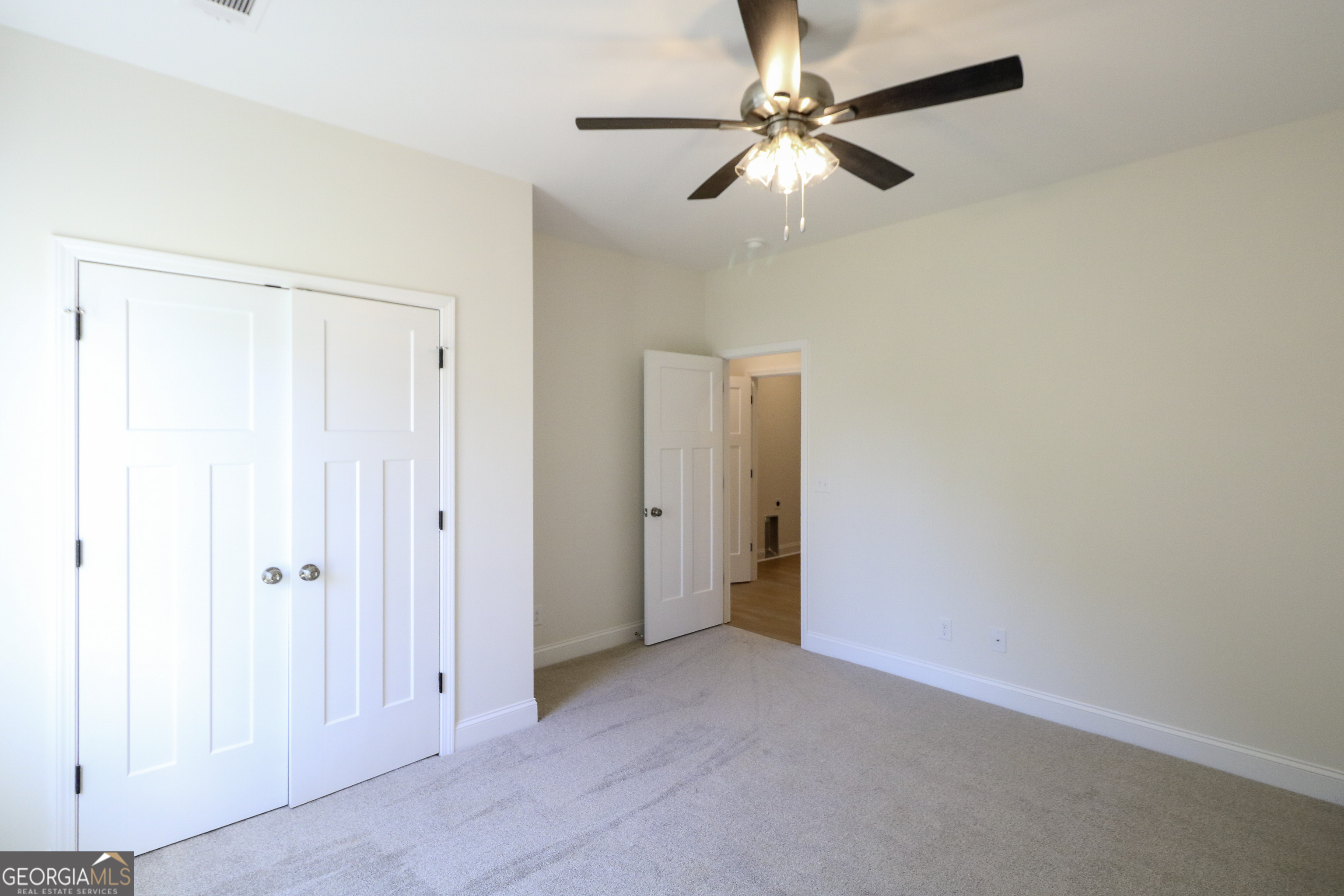 115 Sutter Butte Place Bonaire, GA 31005 - Photo 18 of 38 an empty room with fan