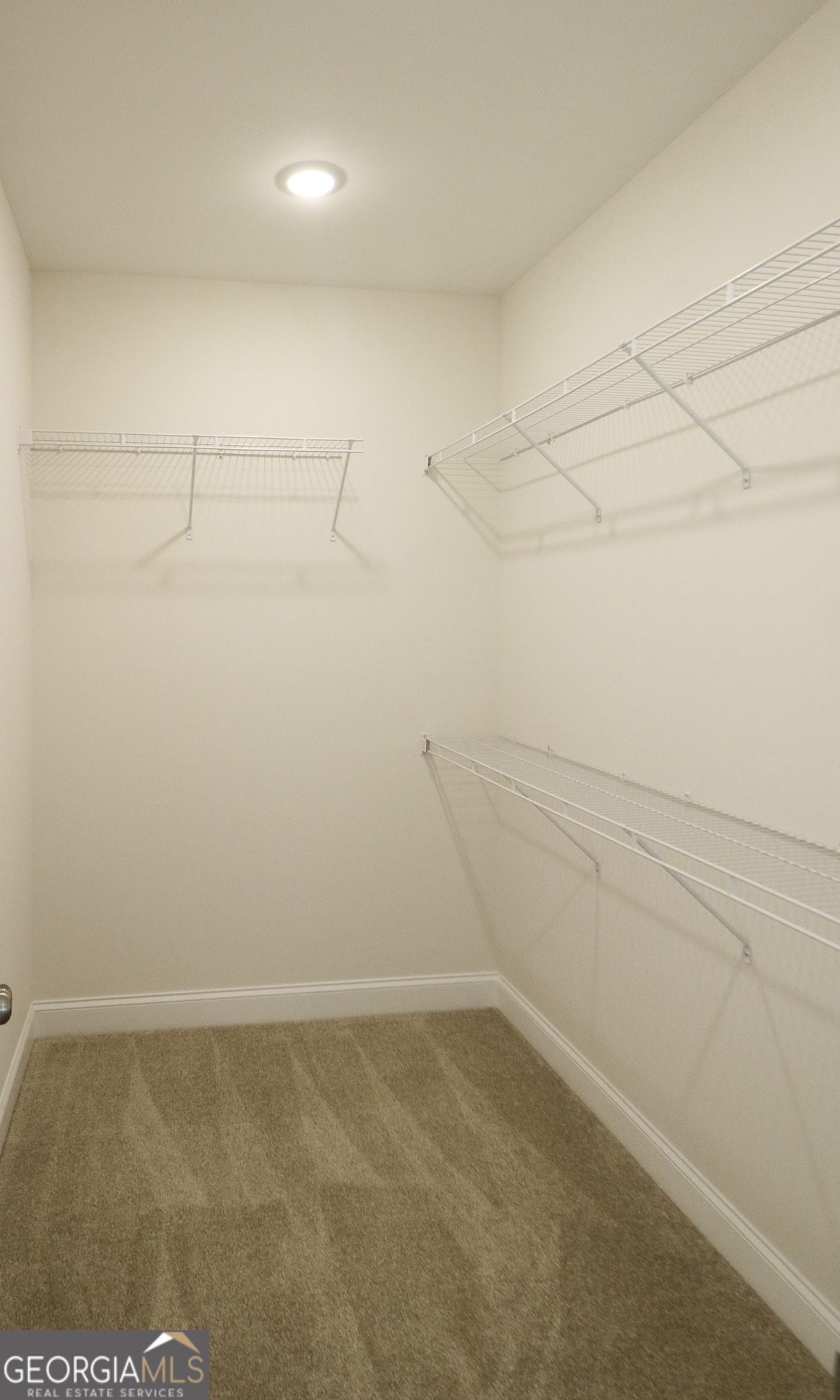 115 Sutter Butte Place Bonaire, GA 31005 - Photo 23 of 38 a view of a room with empty racks