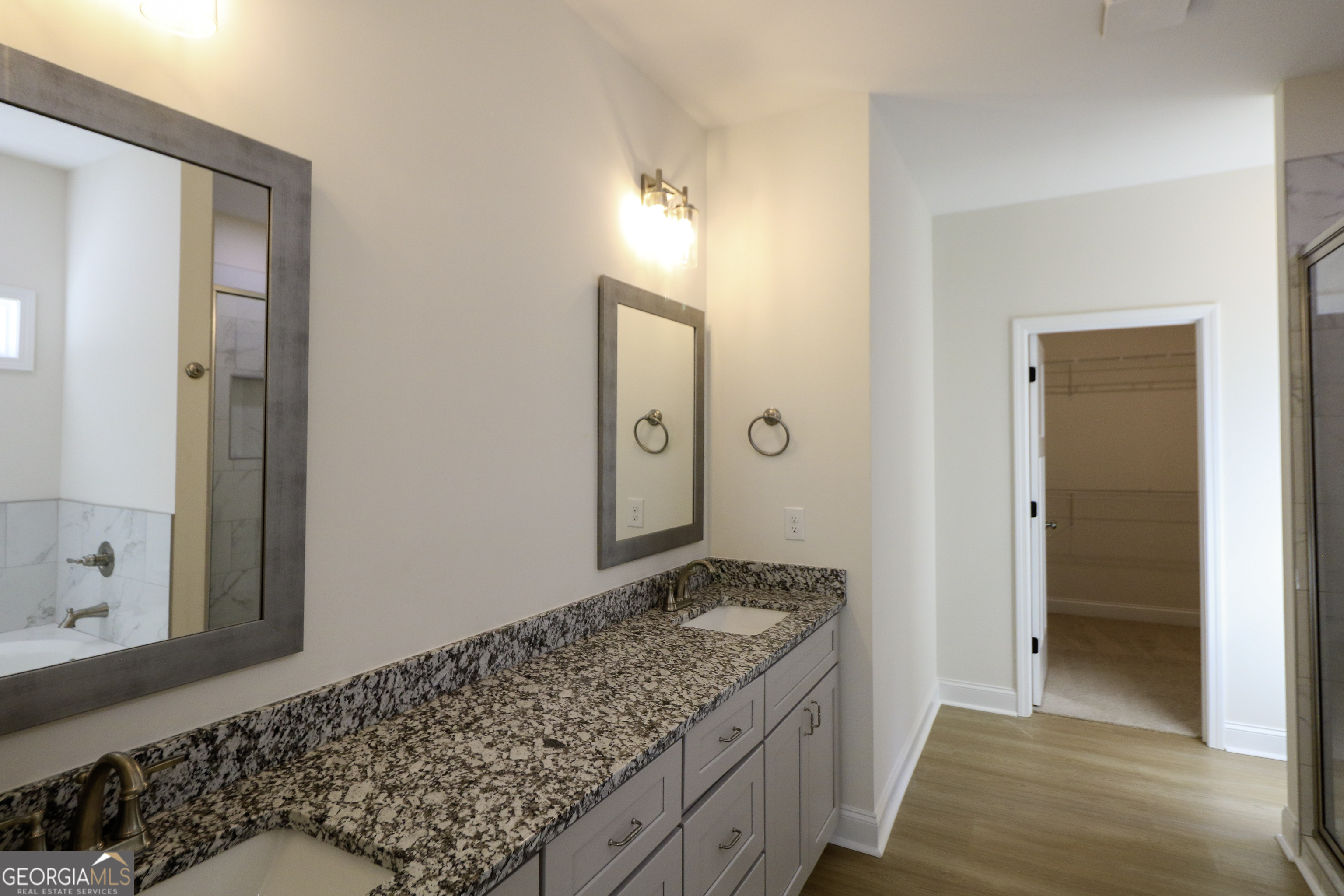 115 Sutter Butte Place Bonaire, GA 31005 - Photo 25 of 38 a bathroom with a granite countertop sink and a mirror