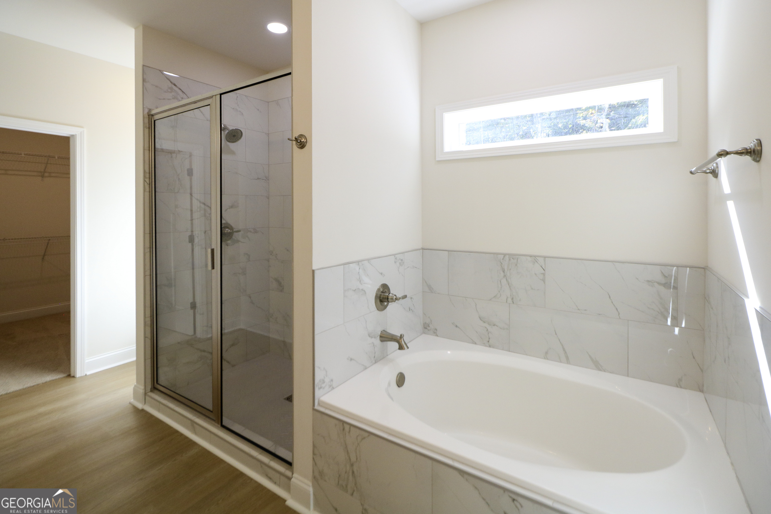115 Sutter Butte Place Bonaire, GA 31005 - Photo 26 of 38 a white bath tub sitting next to a shower