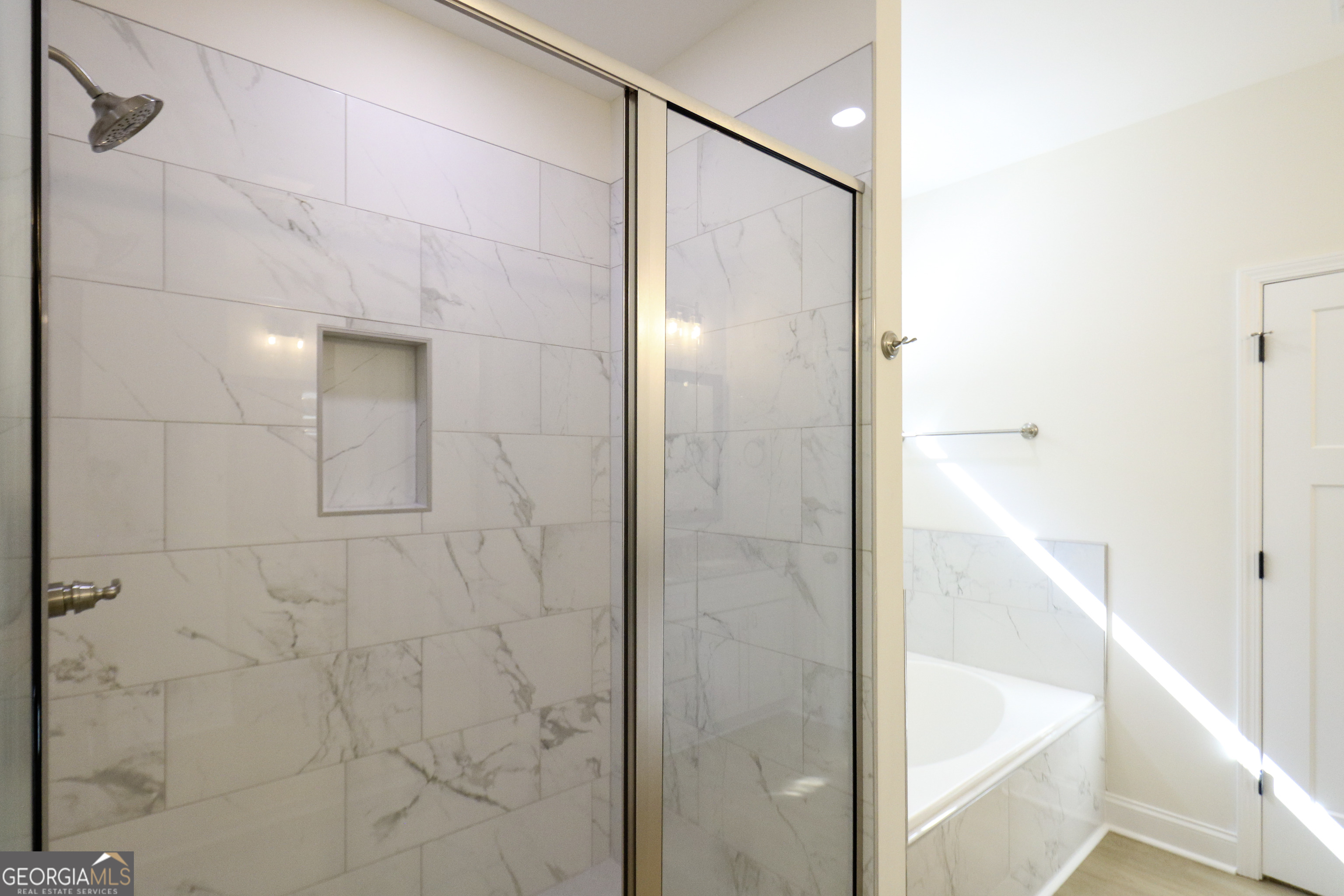 115 Sutter Butte Place Bonaire, GA 31005 - Photo 27 of 38 a bathroom with a bathtub and shower
