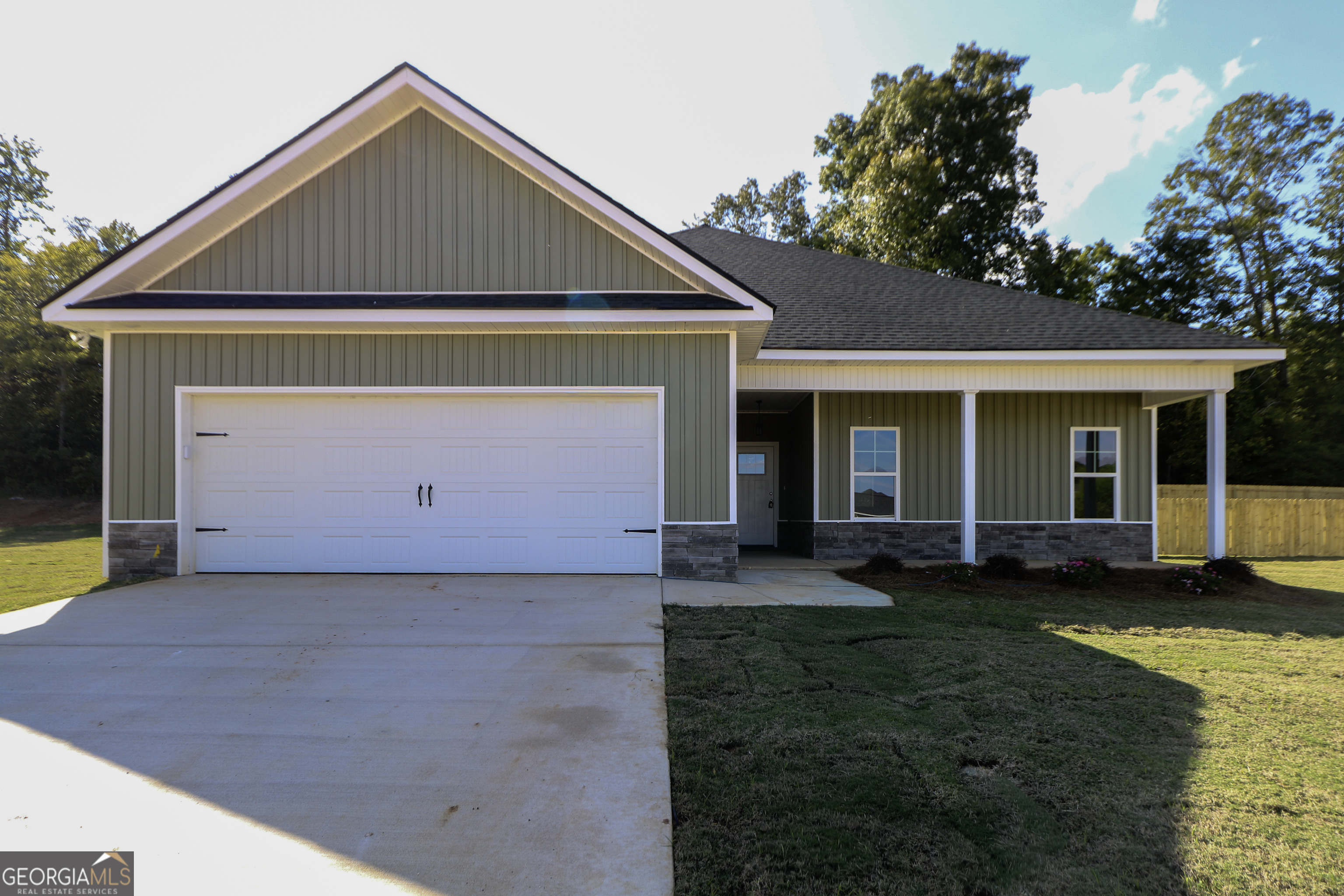 115 Sutter Butte Place Bonaire, GA 31005 - Photo 3 of 38 a front view of a house with a yard and garage