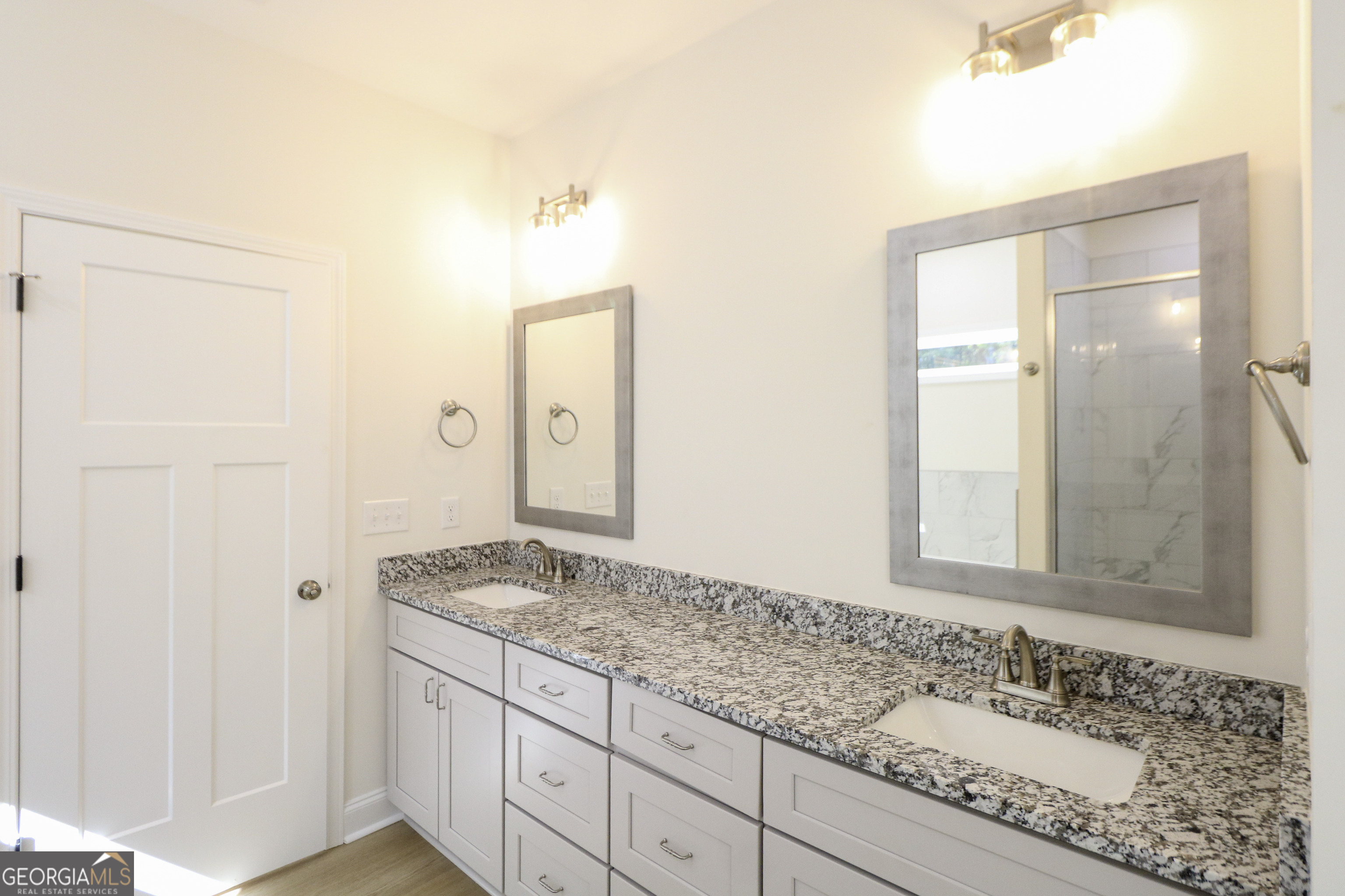 115 Sutter Butte Place Bonaire, GA 31005 - Photo 32 of 38 a bathroom with a granite countertop sink and a mirror