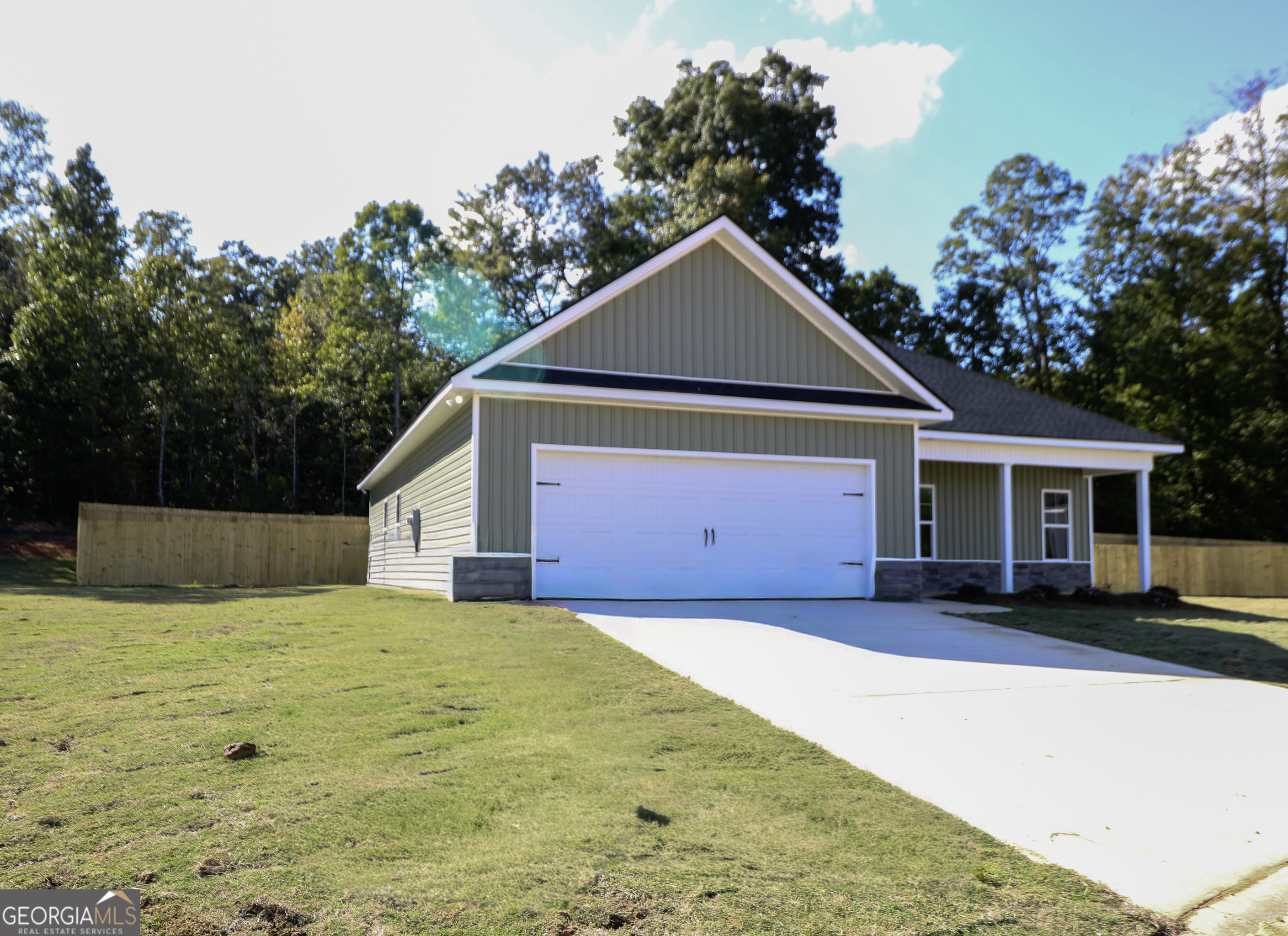 115 Sutter Butte Place Bonaire, GA 31005 - Photo 5 of 38 a house with trees in the background