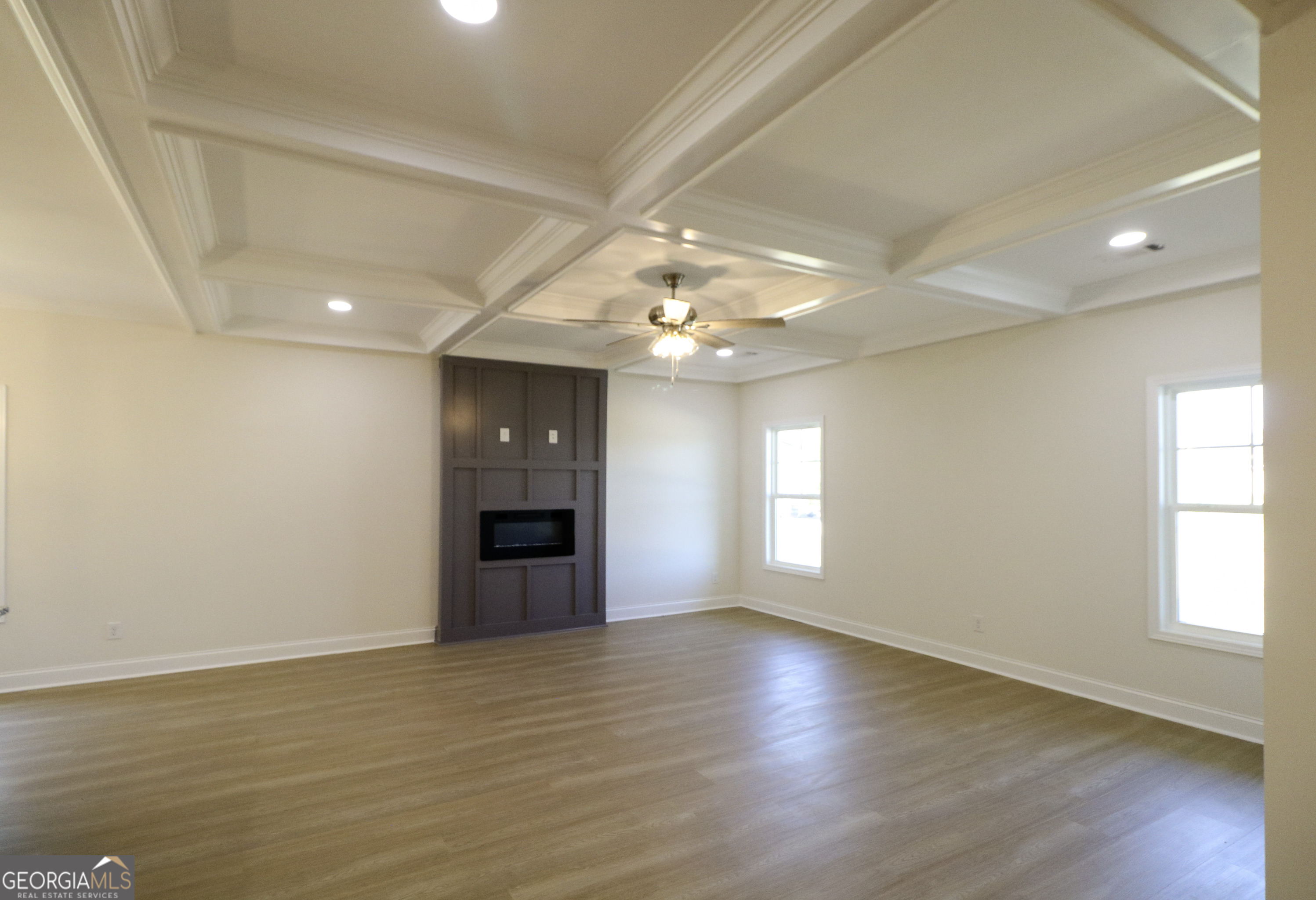115 Sutter Butte Place Bonaire, GA 31005 - Photo 7 of 38 an empty room with wooden floor and windows