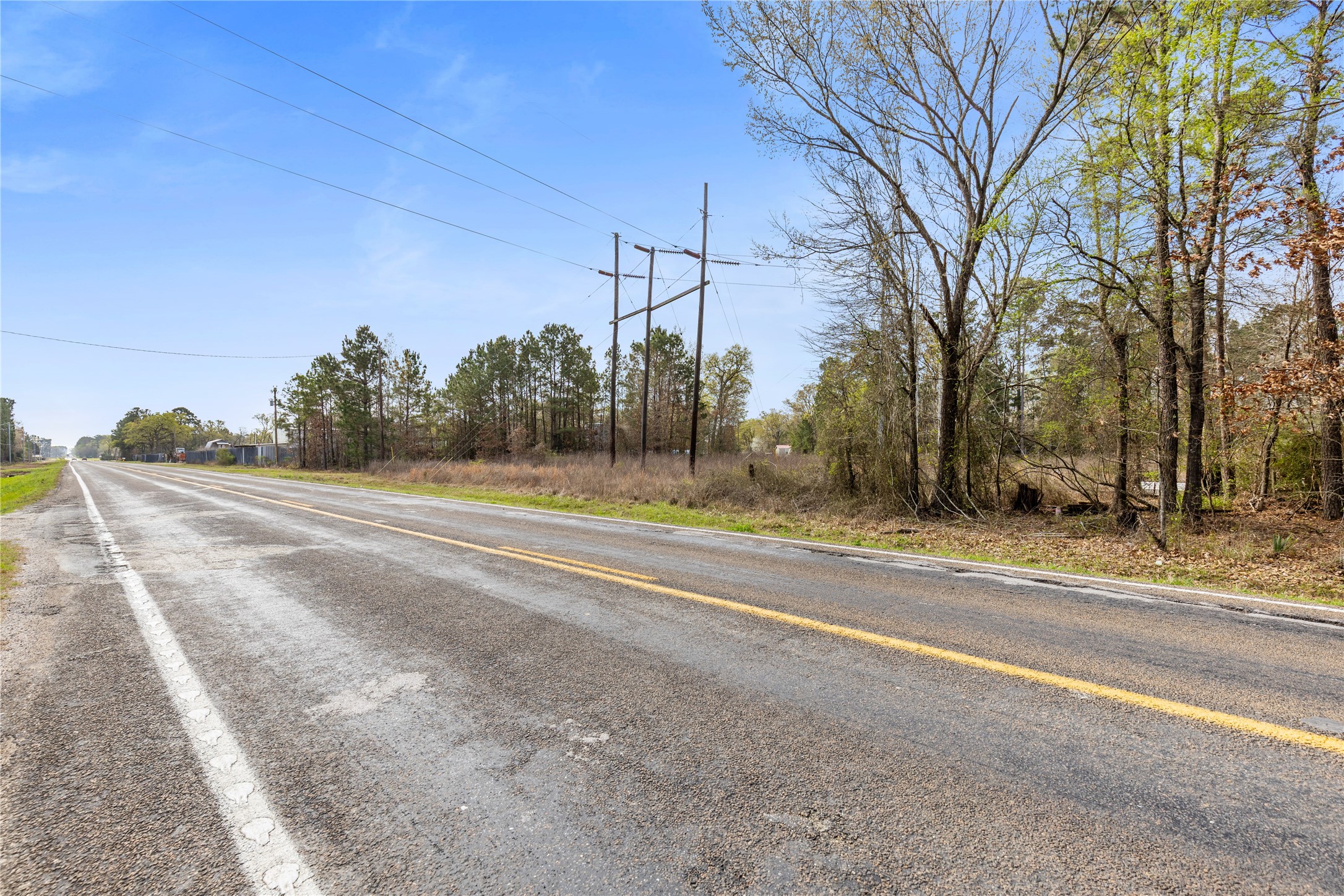 Lot 5 Eagle Falls Boulevard Trinity, TX 75862 - Photo 7 of 8 a view of a road with a building in the background