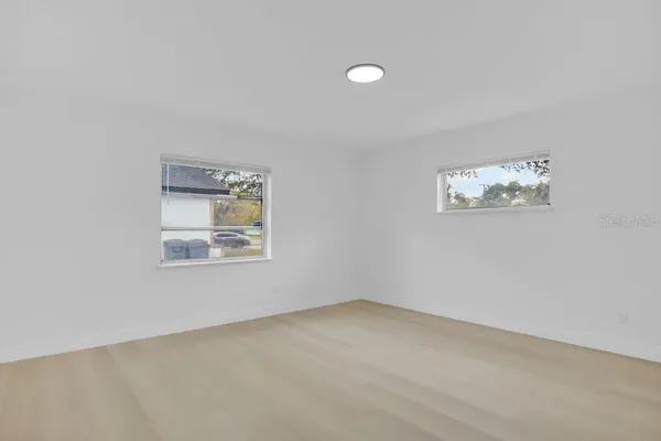 a view of an empty room with a window