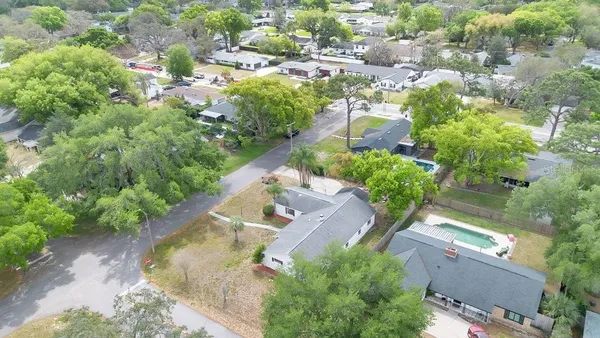 an aerial view of a house with outdoor space
