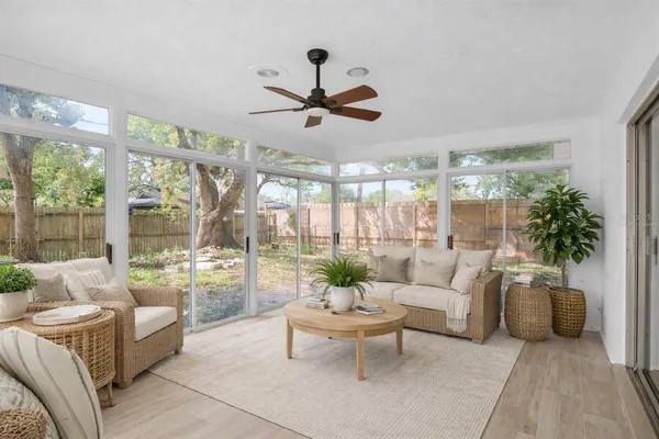 a living room with furniture and a large window