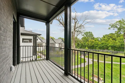 a view of a balcony with wooden floor