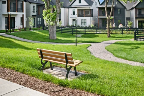 a park bench sitting in the middle of a park