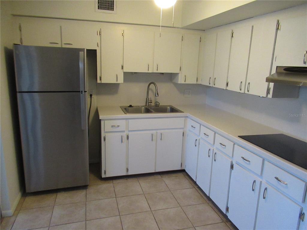 2073 Denmark Street, Unit 5 Clearwater, FL 33763 - Photo 5 of 23 a kitchen with a sink and cabinets