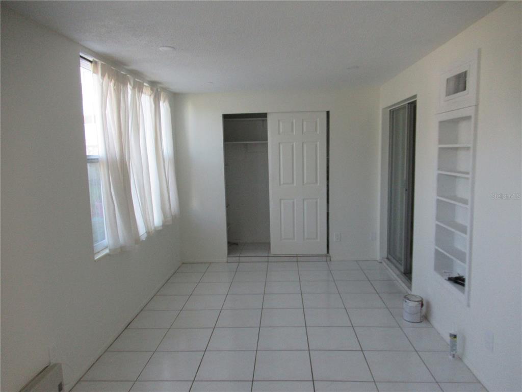 2073 Denmark Street, Unit 5 Clearwater, FL 33763 - Photo 8 of 23 an empty room with windows
