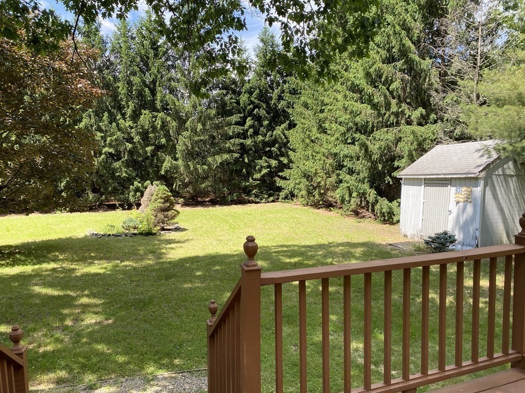 781 Townsend Road Groton, MA 01450 - Photo 6 of 21 a view of a yard with wooden fence