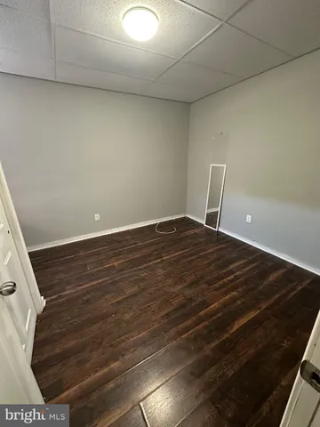 a view of room with wooden floor