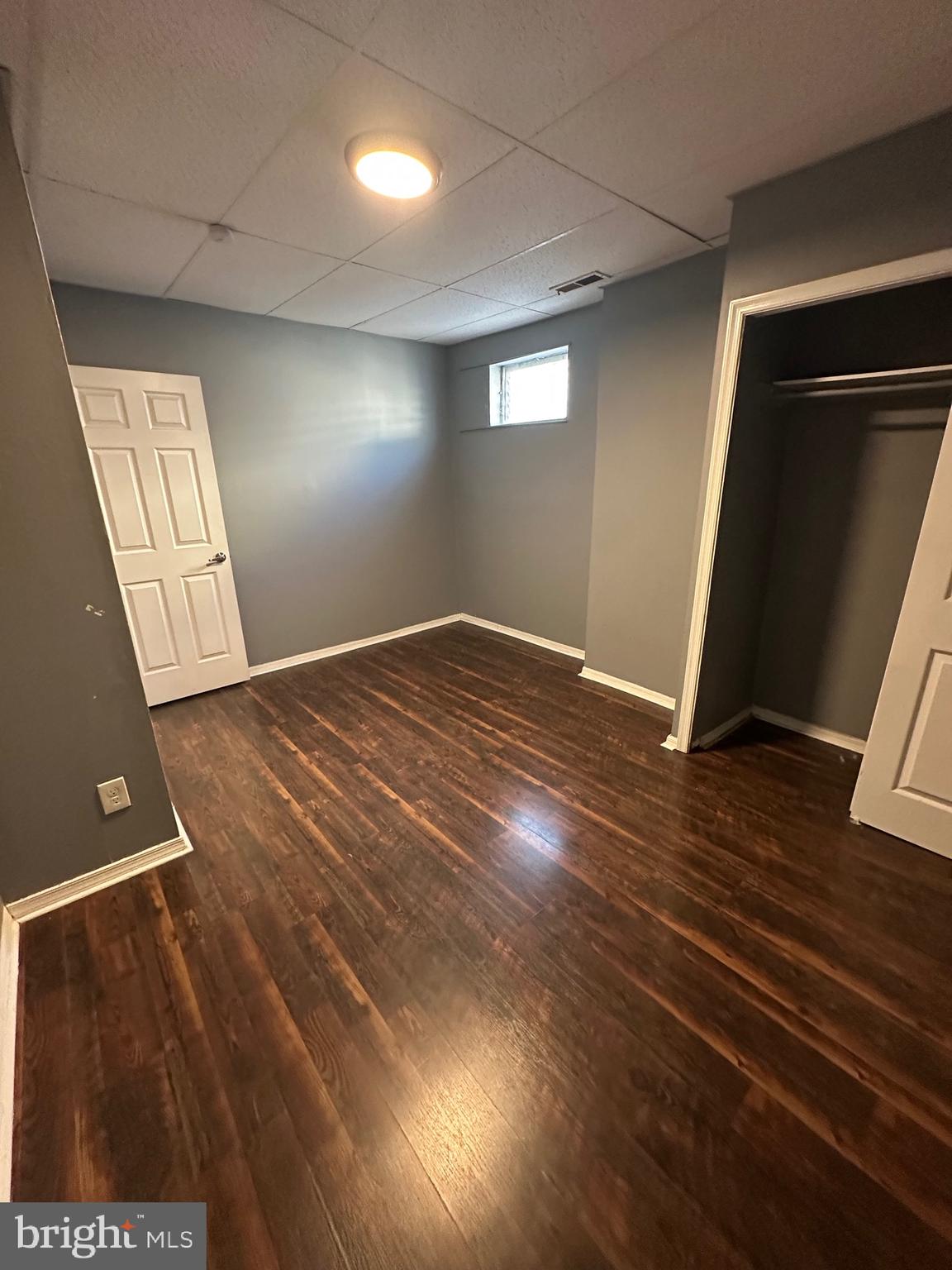 525-527 Penn Street, Unit 1B Camden, NJ 08102 - Photo 10 of 10 an empty room with wooden floor and entrance