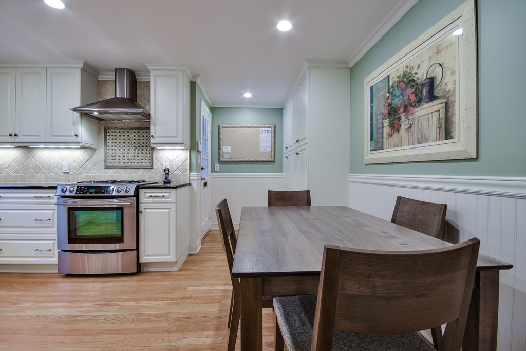 33 Oakridge Road Wellesley, MA 02481 - Photo 13 of 27 a kitchen with a table and chairs in it