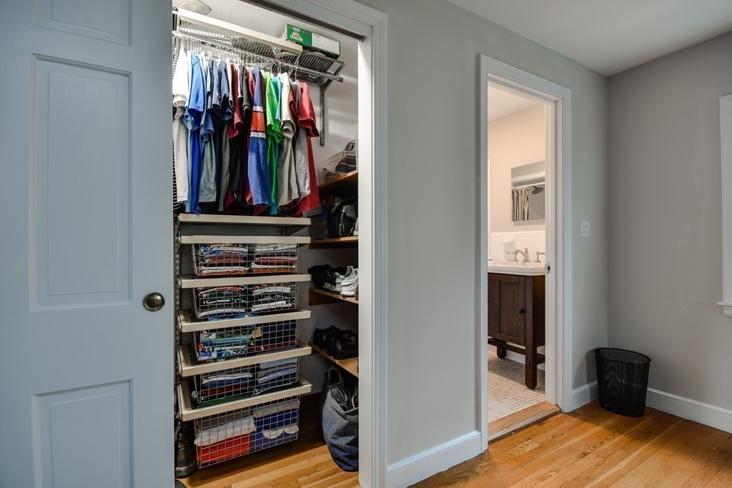 33 Oakridge Road Wellesley, MA 02481 - Photo 18 of 27 a view of walk in closet with clothes and shoes