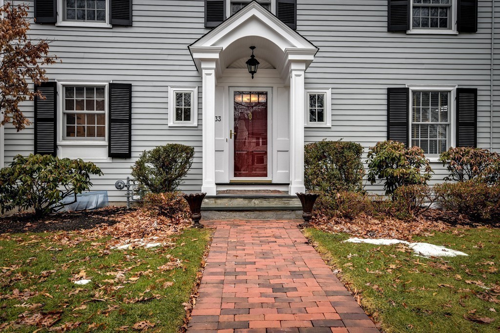 33 Oakridge Road Wellesley, MA 02481 - Photo 2 of 27 a front view of a house with garden
