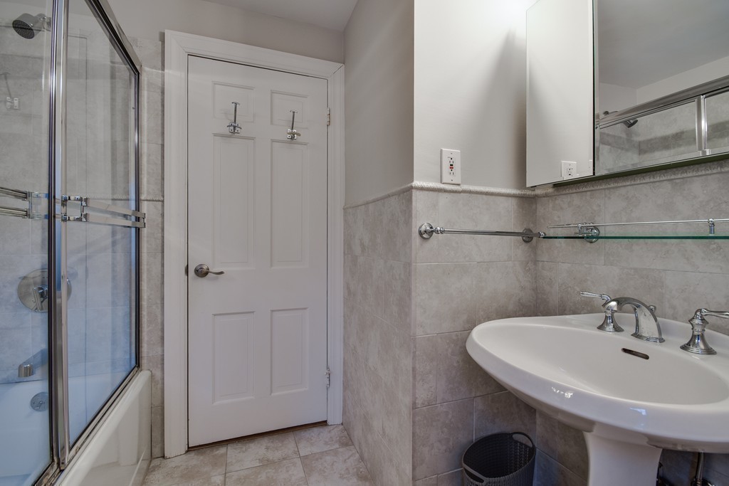 33 Oakridge Road Wellesley, MA 02481 - Photo 21 of 27 a bathroom with a sink and mirror