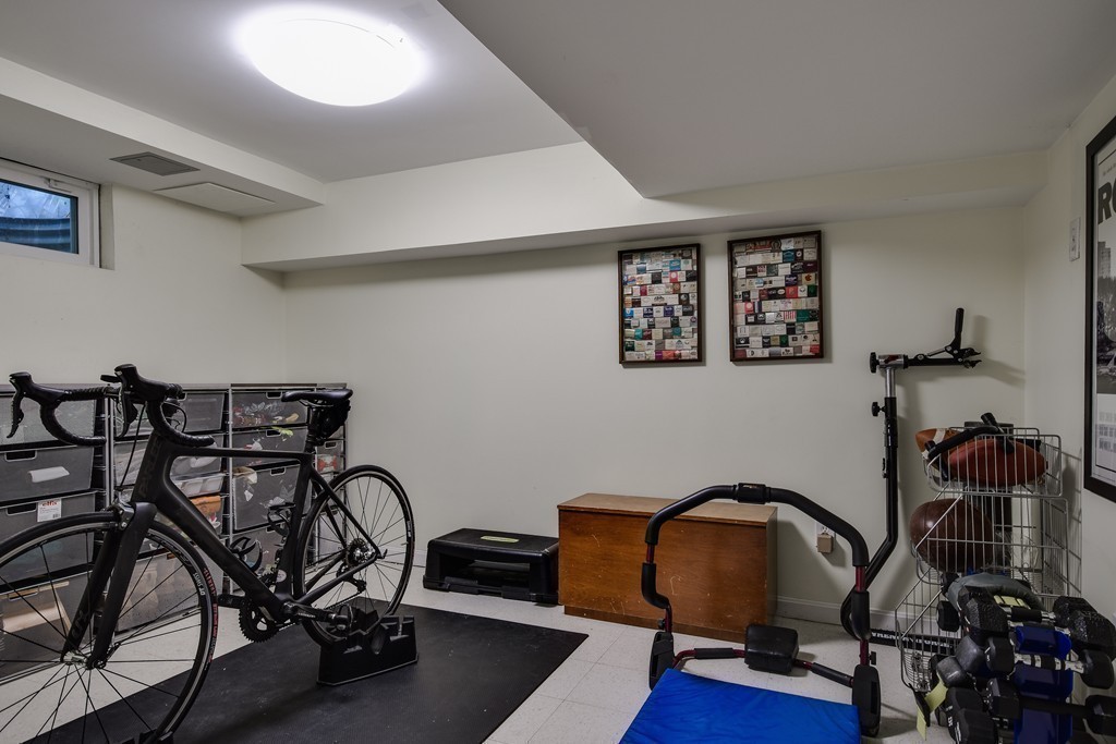 33 Oakridge Road Wellesley, MA 02481 - Photo 26 of 27 a room with gym equipment and wooden floor