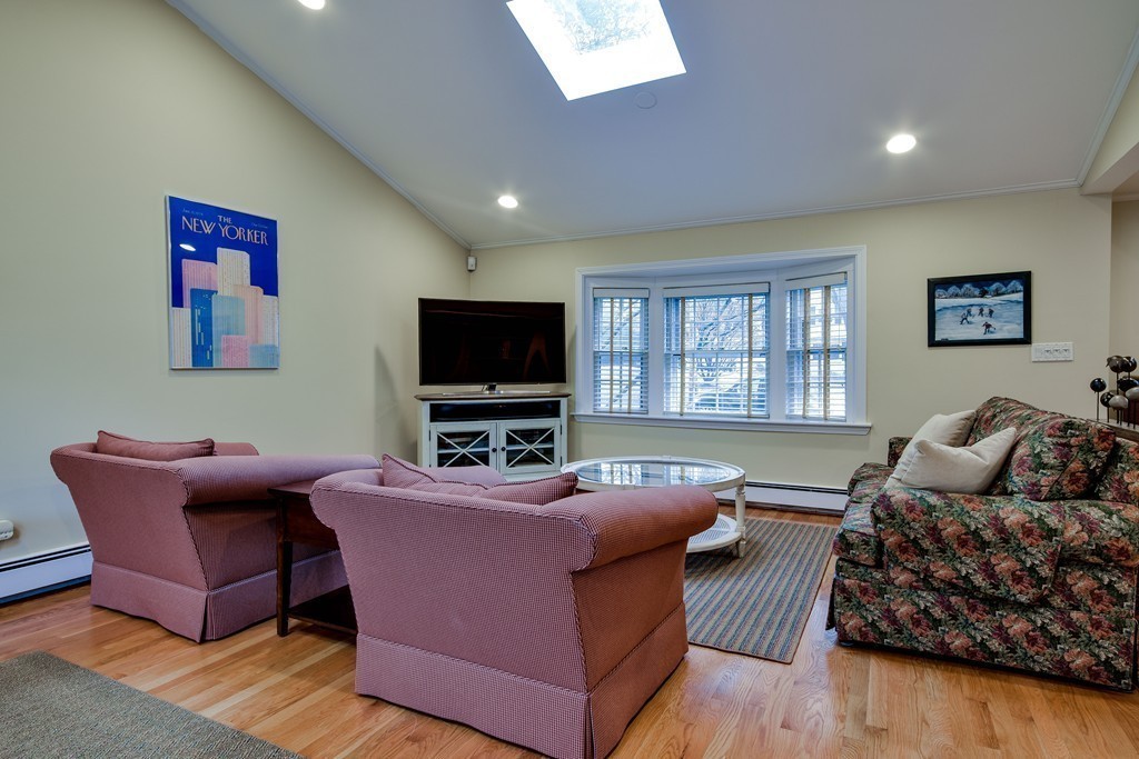 33 Oakridge Road Wellesley, MA 02481 - Photo 7 of 27 a living room with furniture and a flat screen tv