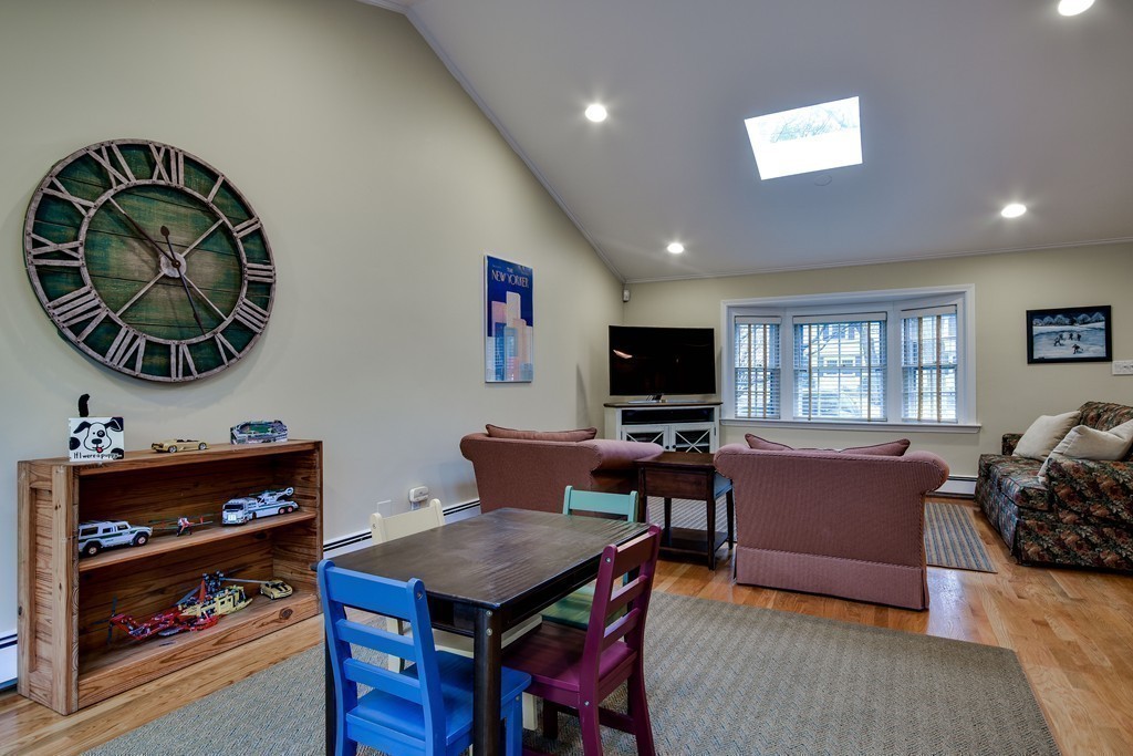 33 Oakridge Road Wellesley, MA 02481 - Photo 8 of 27 a living room with furniture and a flat screen tv