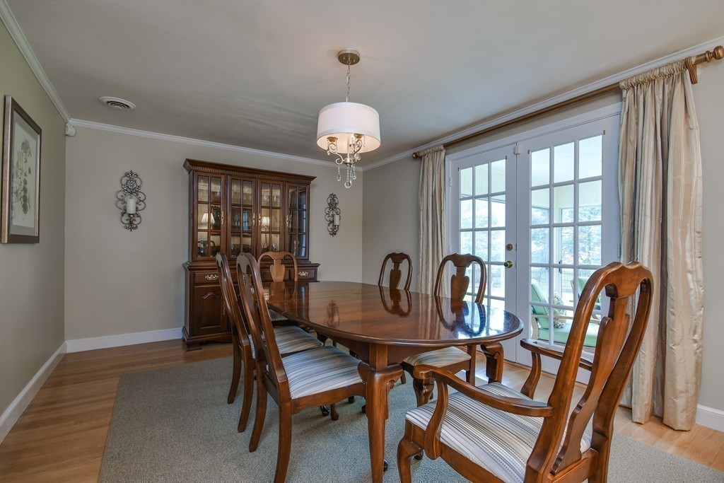 33 Oakridge Road Wellesley, MA 02481 - Photo 10 of 27 a dining room with furniture a chandelier and window