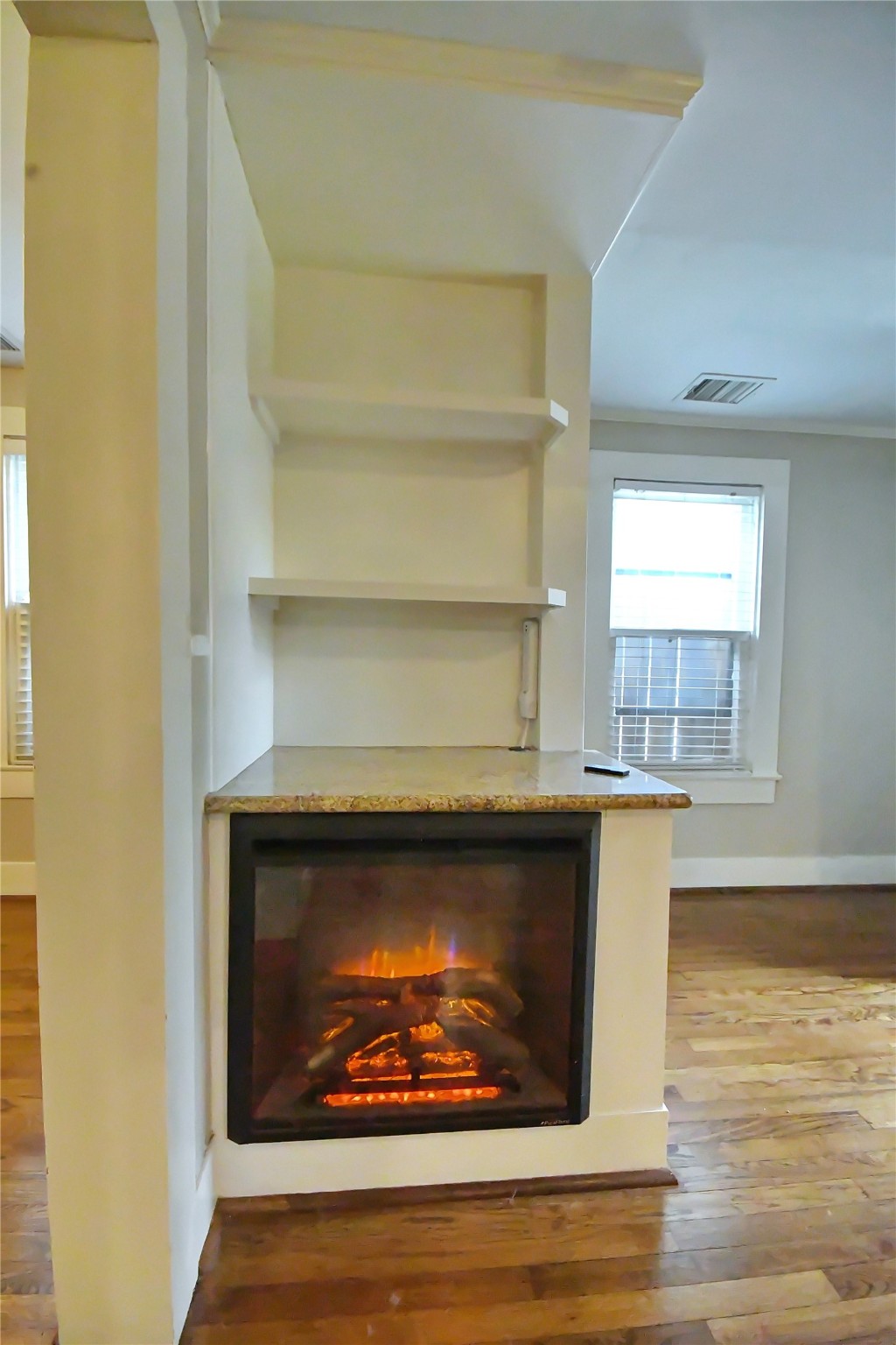 1209 Studewood Street Houston, TX 77008 - Photo 5 of 18 a view of fireplace with wooden floor