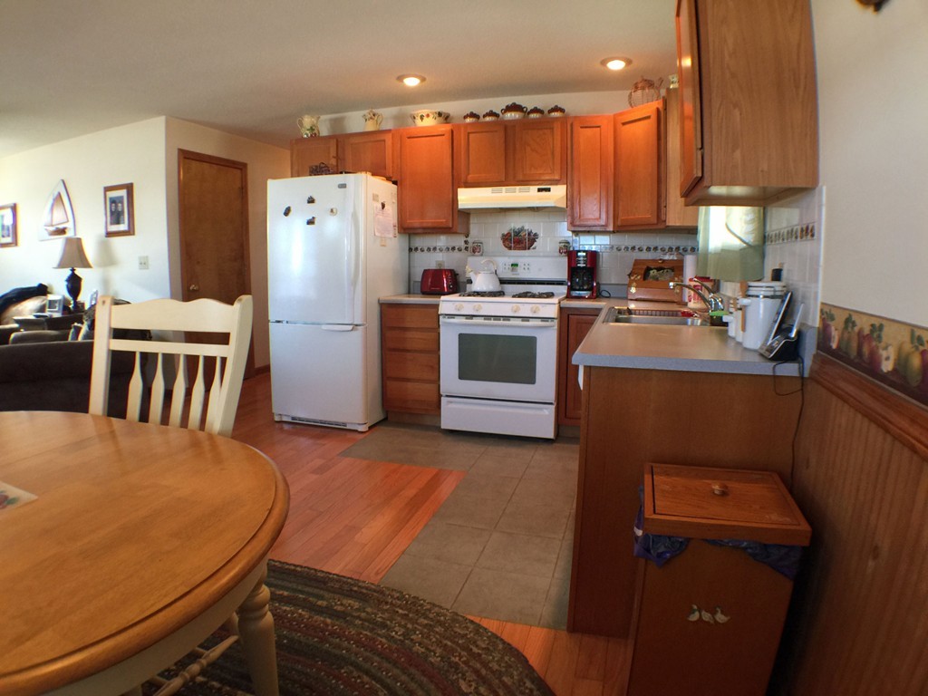 45 Jefferson Street Fall River, MA 02721 - Photo 3 of 16 a kitchen with a refrigerator a stove and a sink