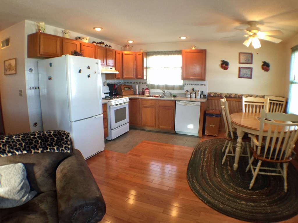 45 Jefferson Street Fall River, MA 02721 - Photo 4 of 16 a kitchen with stainless steel appliances granite countertop a refrigerator a stove and a sink
