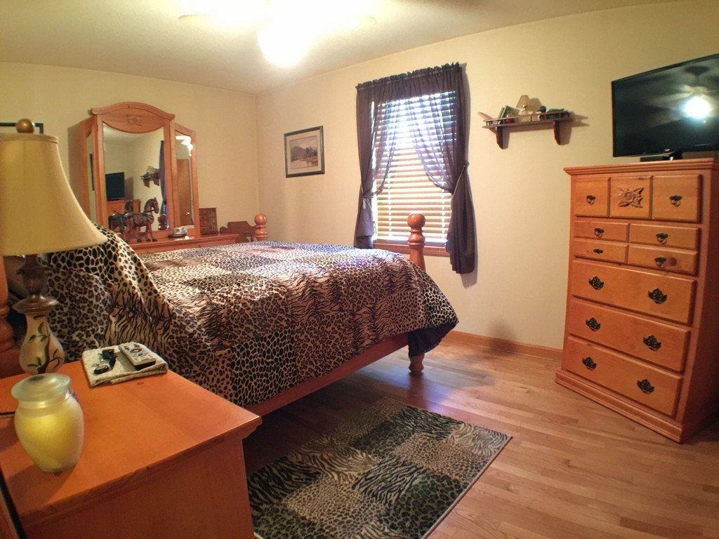 45 Jefferson Street Fall River, MA 02721 - Photo 9 of 16 a bedroom with a bed and flat screen tv