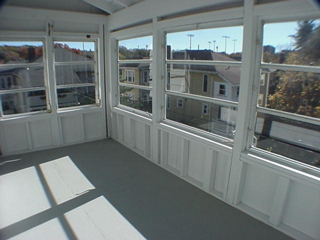 8-10 Kenrick Street, Unit 10 Boston, MA 02135 - Photo 16 of 28 a kitchen with a window and storage