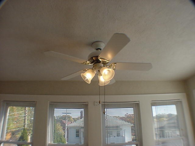 8-10 Kenrick Street, Unit 10 Boston, MA 02135 - Photo 6 of 28 a view of a room with windows and chandelier