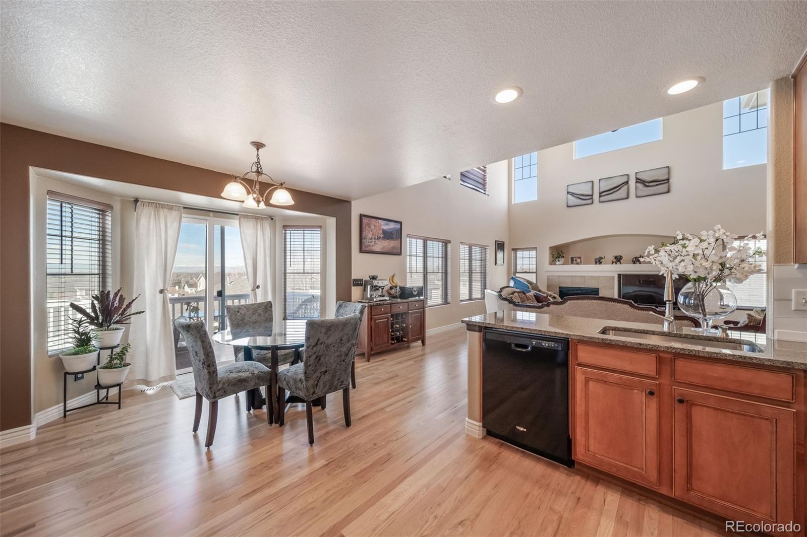 3041 South Jericho Way Aurora, CO 80013 - Photo 17 of 46 a kitchen with lots of counter top space and wooden floor