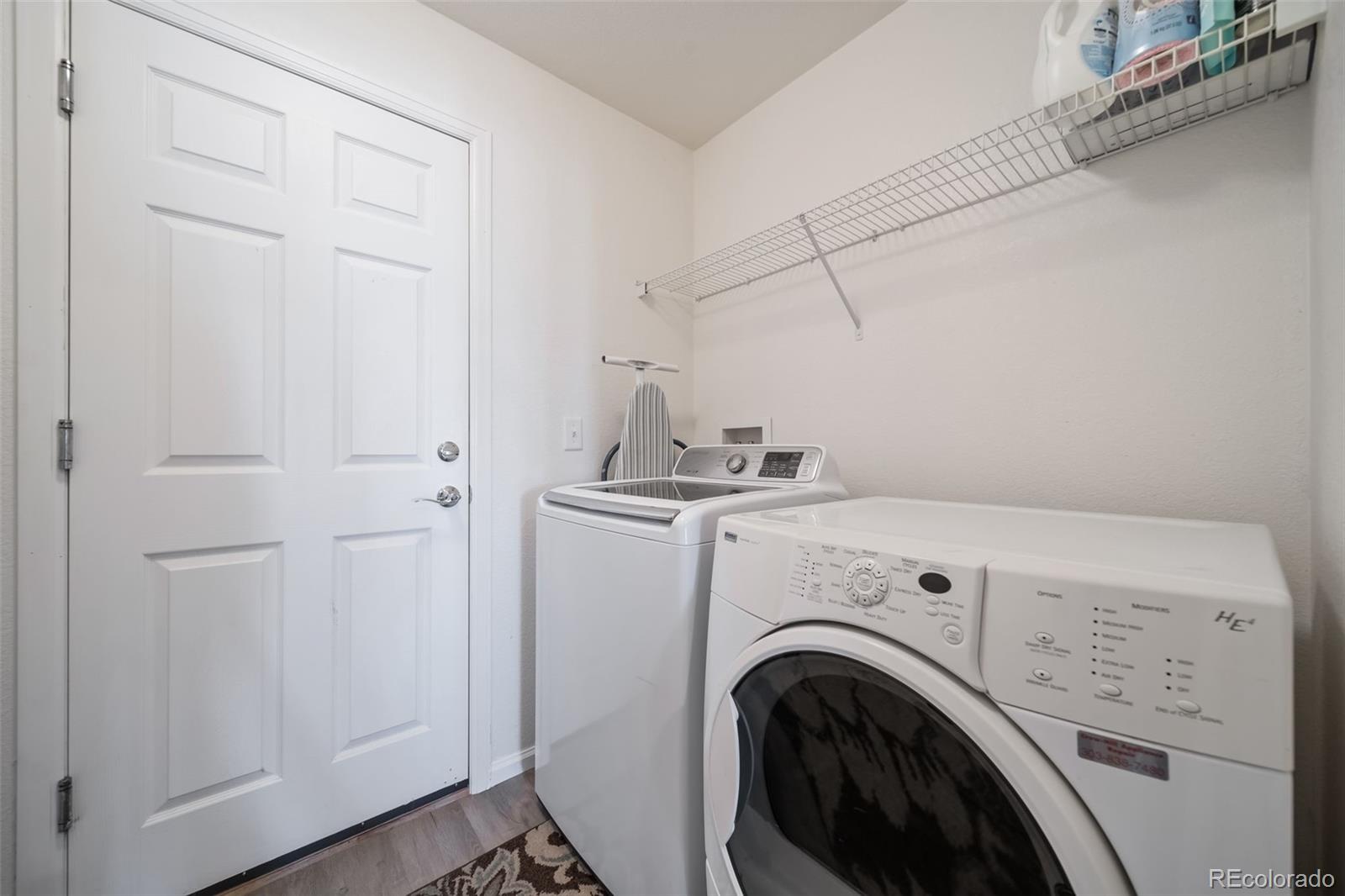 3041 South Jericho Way Aurora, CO 80013 - Photo 20 of 46 a view of storage and utility room with washer and dryer