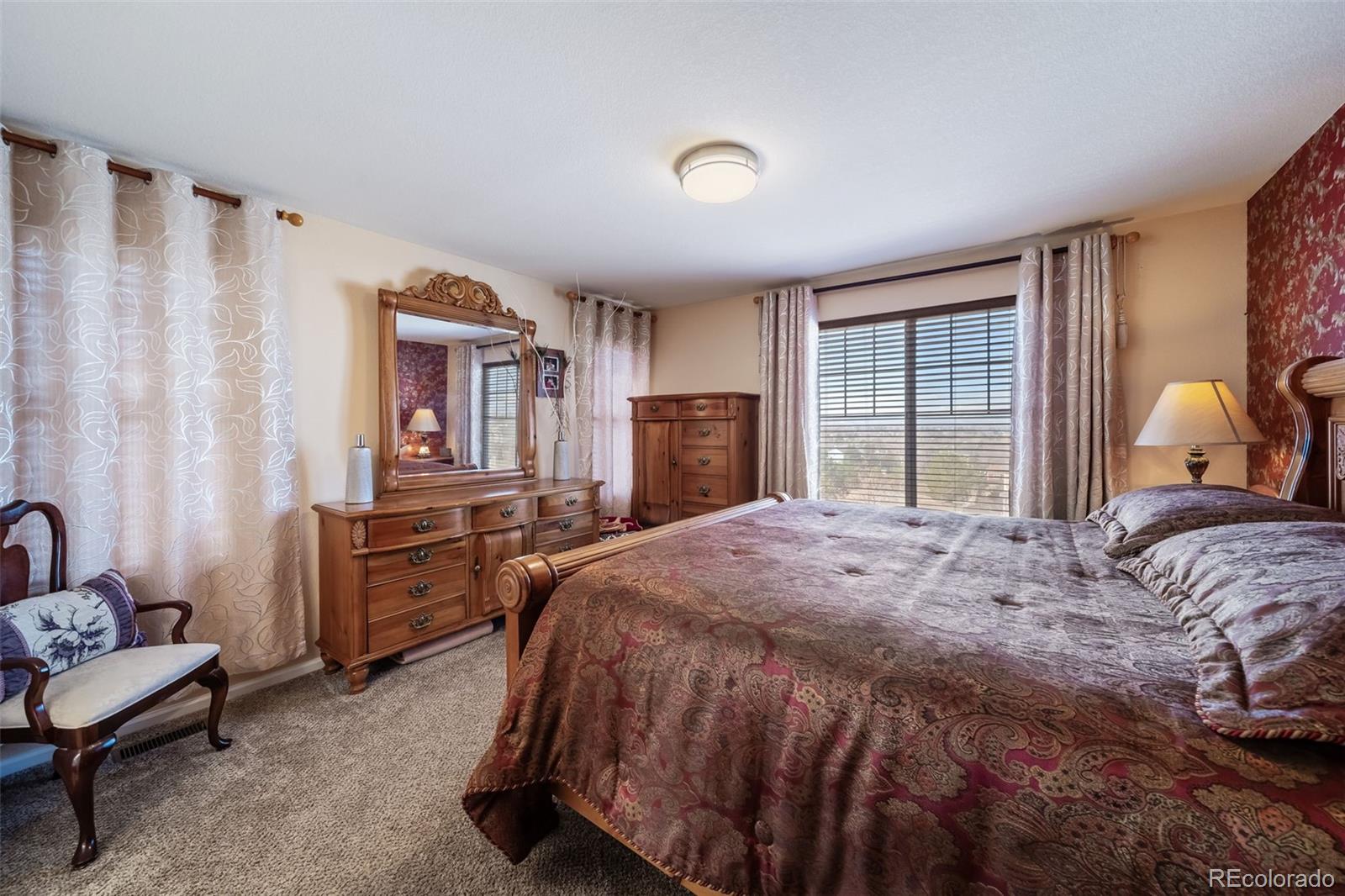 3041 South Jericho Way Aurora, CO 80013 - Photo 26 of 46 a bedroom with a bed and furniture